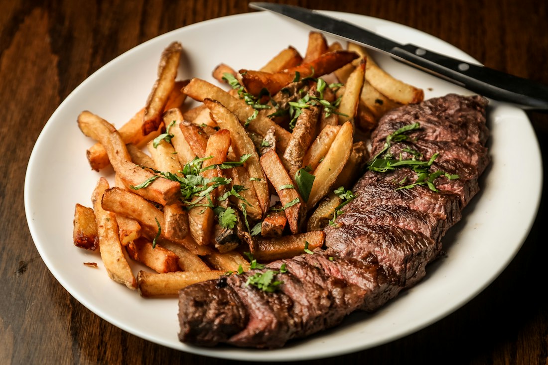 Chef's grilled steak plate with rosemary butter