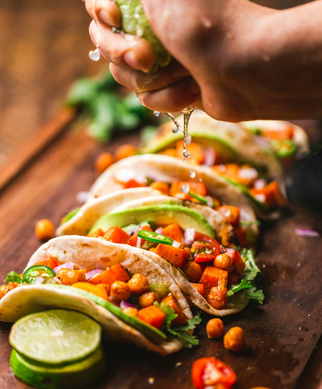 A wrap being prepared with grilled chicken